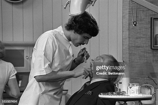 Closer inspection of those in this dental office will reveal two faces that are familiar to all Americans. In the chair is Bob Hope, and doing the...