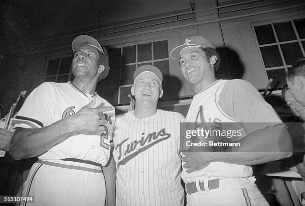 Detroit, Michigan: Frank Robinson, Harmon Killebrew and Reggie Jackson celebrate in dressing room here July 13th after the American League beat the...