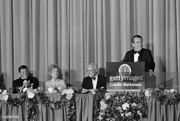 Los Angeles, California: President Nixon addresses a $1,000-a-plate GOP fund raising dinner at the Century Plaza Hotel. Looking on are California...