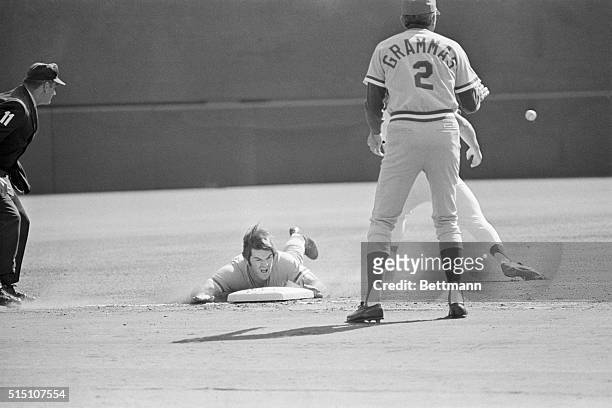 The Reds' Pete Rose slides headlong into third in first inning 10/8 advancing from first on Joe Morgan's hit to Clemente. Rose scored the first of...
