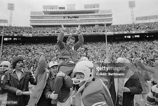 Darrell Royal, head coach of the University of Texas is carried off the field by his players following Texas' victory over Alabama in the Cotton Bowl...