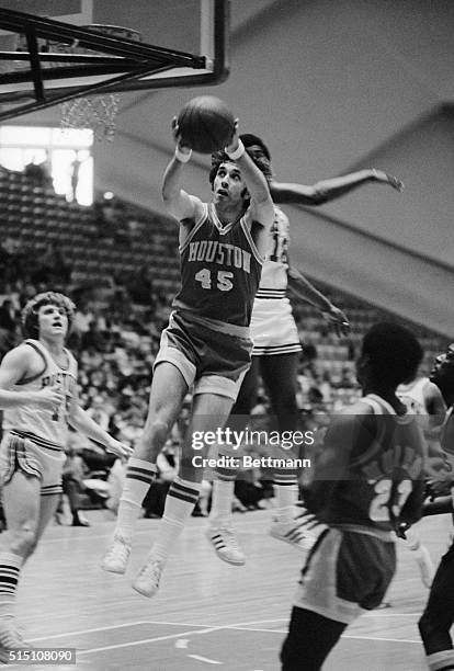 Detroit: Former U-M star Rudy Tomjanovich drives score two points for the Houston Rockets during the game against Detroit Pistons. Detroit won,...