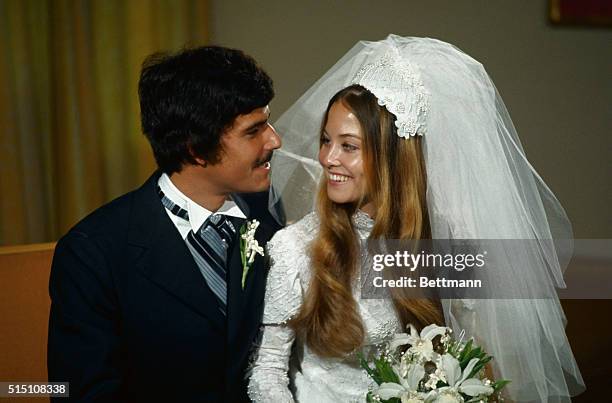 Olympic gold medalist Mark Spitz poses with Susan, his bride.