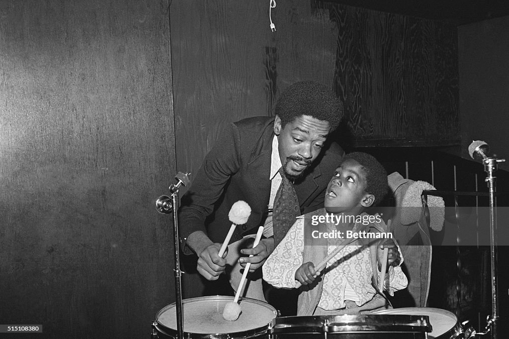 Bobby Seale Playing Drums with Son