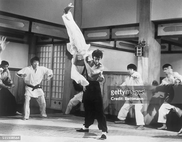 Picture shows actor, Bruce Lee, taking on the entire membership of a Japanese boxing club from the movie "The Chinese Connection'. Filed 5/27/73.