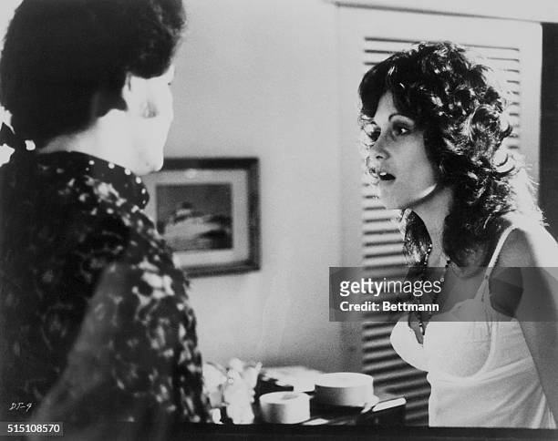 Actress Linda Lovelace talking to another actor in the 1972 pornographic film Deep Throat.