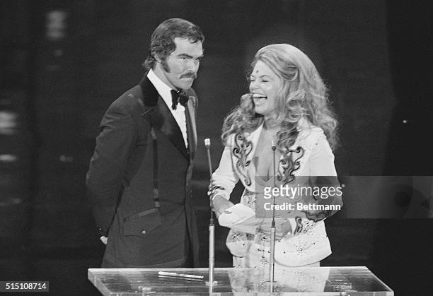 Burt Reynolds and Dyan Cannon laugh it up as they prepare to make a presentation during the 45th Annual Academy Awards ceremony. Canon and Reynolds...