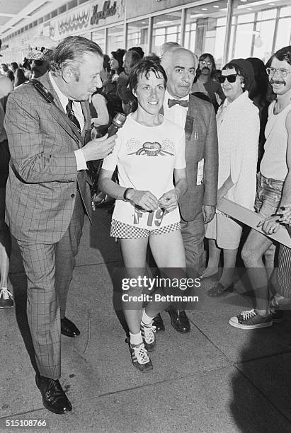 Boston: Marathoner Jacqueline Hansen of California State Univ., is followed by newsmen after winning the women's division of the 26-mi., 385 yd.,...