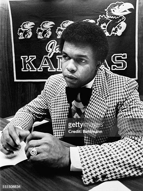 Gale Sayers, Chicago Bears All-Pro Running Back, sits as his desk as he begins his new job at the University of Kansas as the Assistant Athletic...