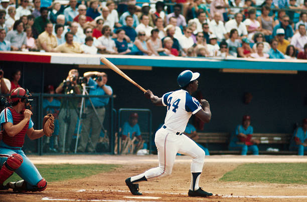 Hank Aaron of the Atlanta Braves hits his 700th home run against the Phils here. The 39-year-old outfielder is not just 14 home runs behind Babe...