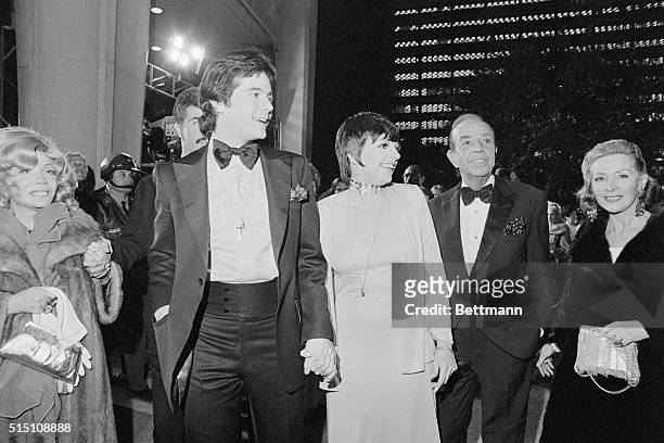 Actress Liza Minnelli and Desi Arnaz Jr., arrive at the Music Center to attend the 45th Annual Academy Awards presentations. Miss Minelli is...