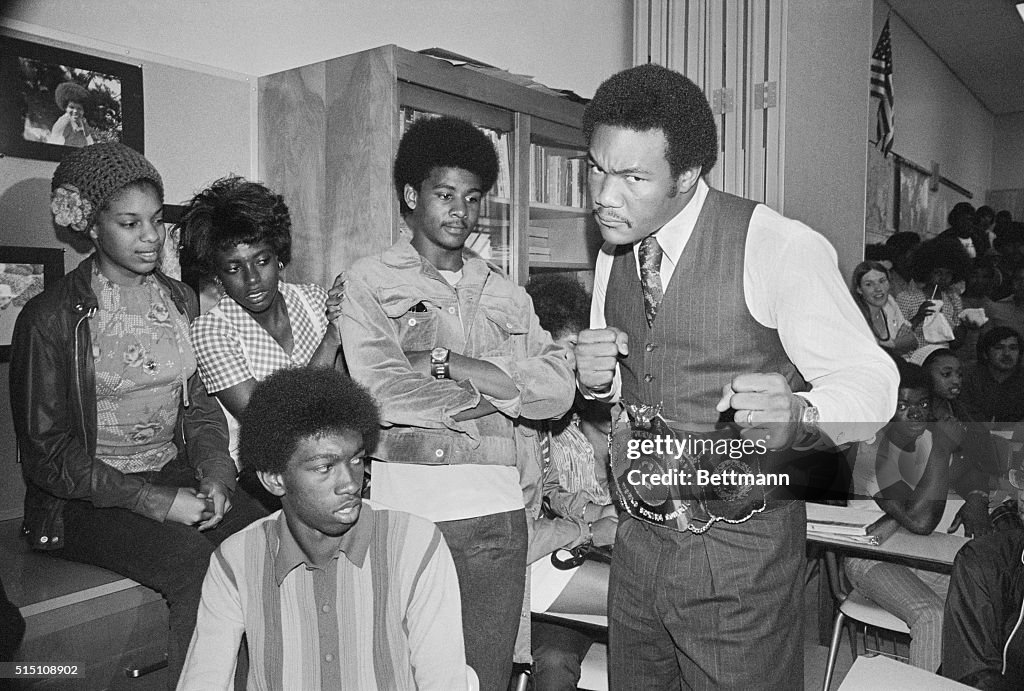 George Foreman Wearing Heavyweight Belt