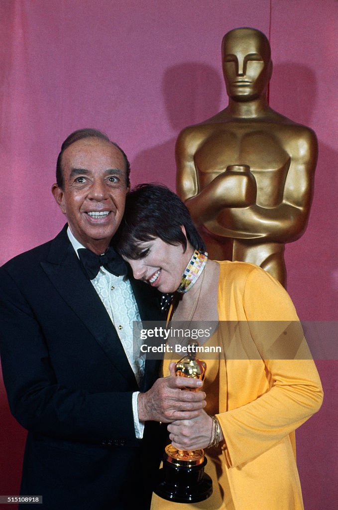 Liza and Vincent Minnelli Standing Near Large Oscar Replica