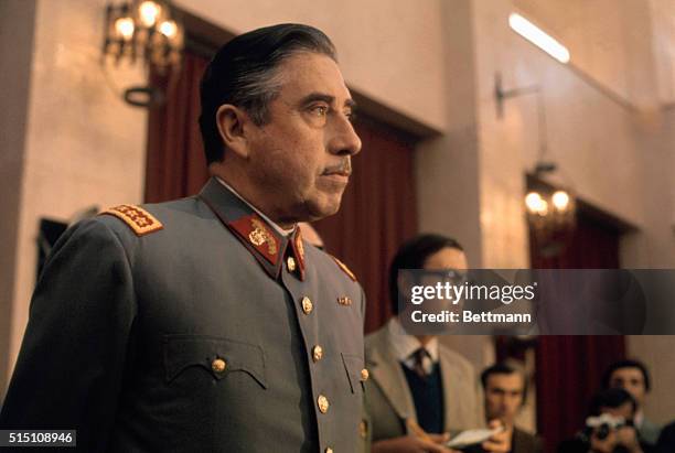 General Augusto Pinochet, head of Chile's ruling military junta, holds a news conference at Santiago's War College on September 21, 1973. Pinochet...