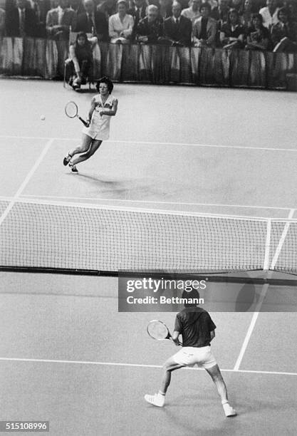 Billie Jean King returns the ball to Bobby Riggs during the first set of their $100,000 battle of the sexes at the Astrodome 9/20.