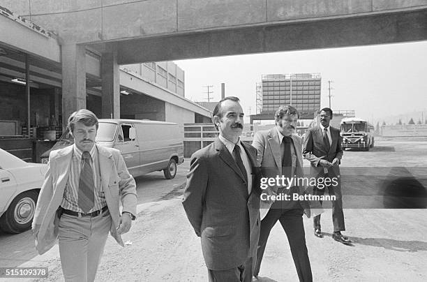 Los Angeles: A handcuffed G Gordon Liddy, , a member of the White House Security "Plumbers" squad, arrives at Los Angeles Count jail to await...