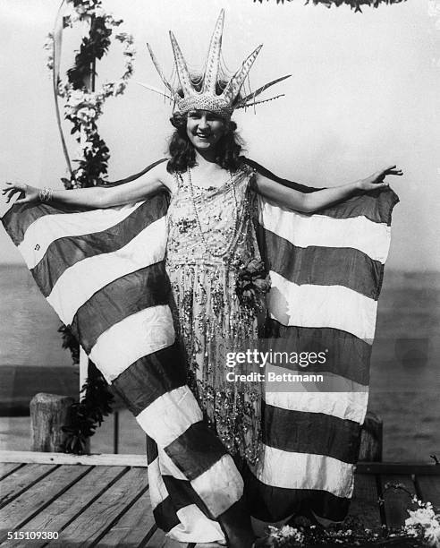 Miss Margaret Gorman--Miss America--awaits the arrival of 'Neptune' on the yacht club dock, on the opening day of the National Beauty Pageant.