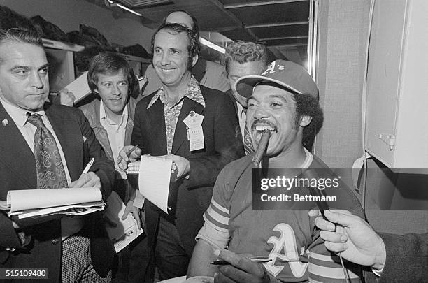 Oakland, Calif.: The Most Valuable Player of the 1973 World Series, Oakland A's outfielder Reggie Jackson, smokes a victory cigar after the A's won...