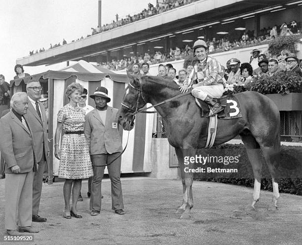 Secretariat basks in the winner's circle at Belmont Park following the 1972 Futurity, surrounded by trainer Lucien Laurin, Mr. And Mrs. John B....