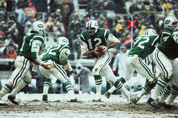 New York. Jets Joe Namath in action during a football game with Buffalo Bills at Shea Stadium in the snow.