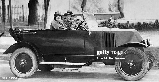 Celebrated American novelist F. Scott Fitzgerald, his wife Zelda, and daughter, Scottie, go for a motor jaunt somewhere in Italy in this undated...