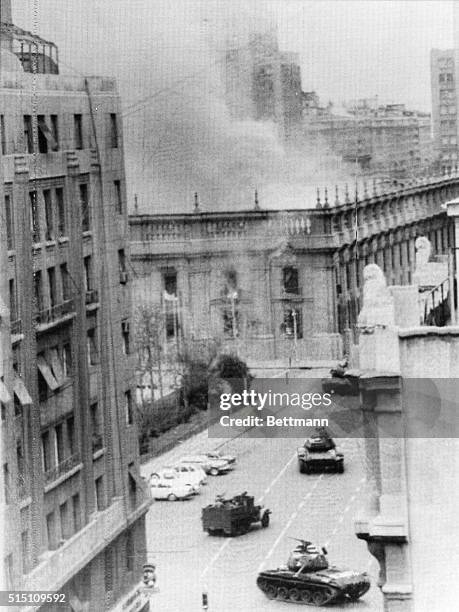 Presidential Palace, La Moneda, is shown in flames, as tanks fire at point blank range here on September 11, 1973. The building was bombed by jets as...