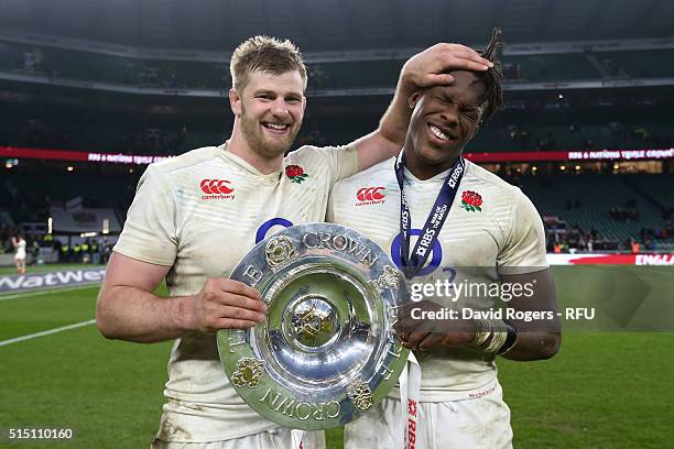 George Kruis and Maro Itoje of England celebrate with the Triple Crown trophy after the RBS Six Nations match between England and Wales at Twickenham...
