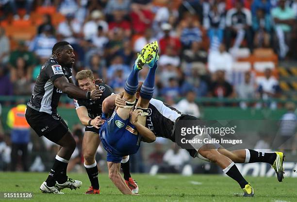 Schalk Burger of the Stormers is tackled by Paul Jordaan of the Sharks during the 2016 Super Rugby match between DHL Stormers and Cell C Sharks at...