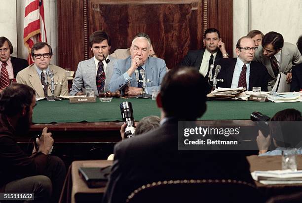 Senate Watergate committee Chairman Sen. Sam Ervin questions former presidential aide John Ehrlichman during the panel's hearing. Seated at left is...