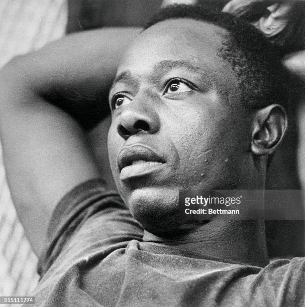 Braves' Hank Aaron relaxes in Braves' clubhouse after celebration and hoopla following Atlanta's clinching of National League Western division flag...