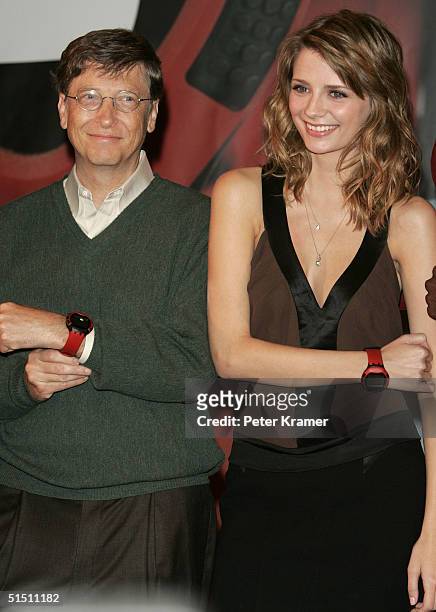Actress Mischa Barton and Microsoft CEO Bill Gates attend a press conference for the launch of the new Swatch line "Paparazzi" by Swatch and...