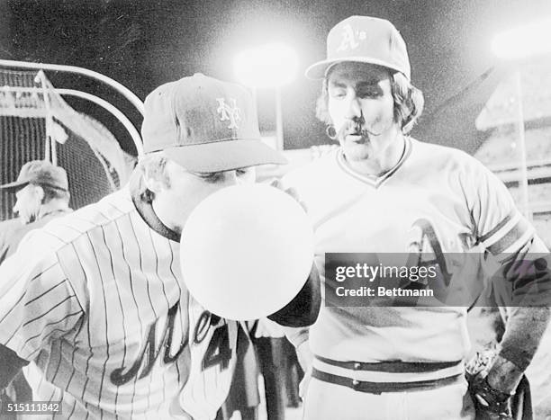 Two ace relievers get a bit of relief from the World Series tension prior to 10-16 game here as Mets' ace Tug McGraw blows huge bubble-gum bubble...