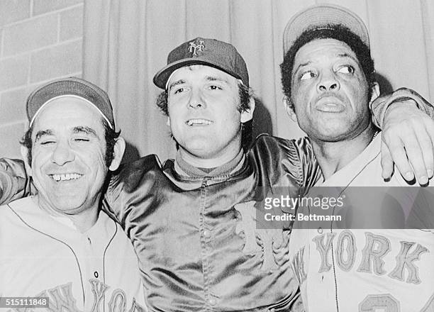It's all smiles for New York Mets manager Yogi Berra , pitcher Tug McGraw, and Willie Mays after the Mets won the second game of the 1973 World...
