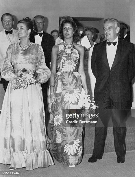 Monte Carlo, Monaco: With Prince Rainier of Monaco, radiant Princess Grace and her daughter Princess Caroline both wearing Christian Dior gowns,...