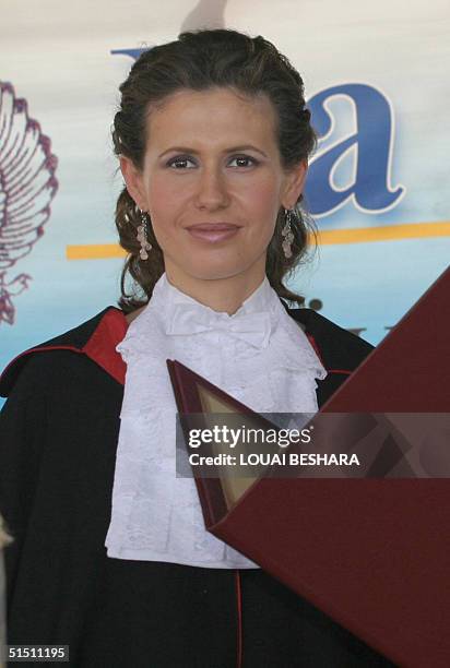 Syria's First Lady Asma al-Assad receives an honorary doctorate from the Faculty of Archeology of Rome's La Sapienza University during an official...