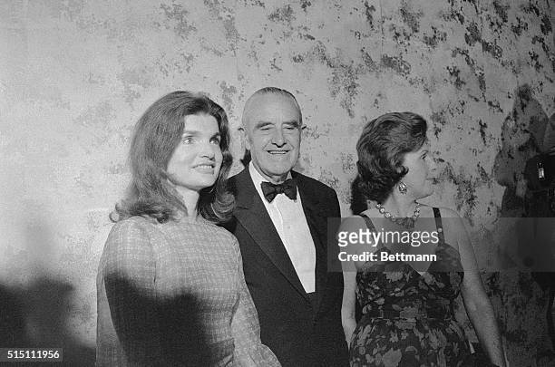 Mrs. Jacqueline Onassis and W. Averell Harriman and his wife Pamela pose for photographers at a testimonial dinner for Harriman honoring the...