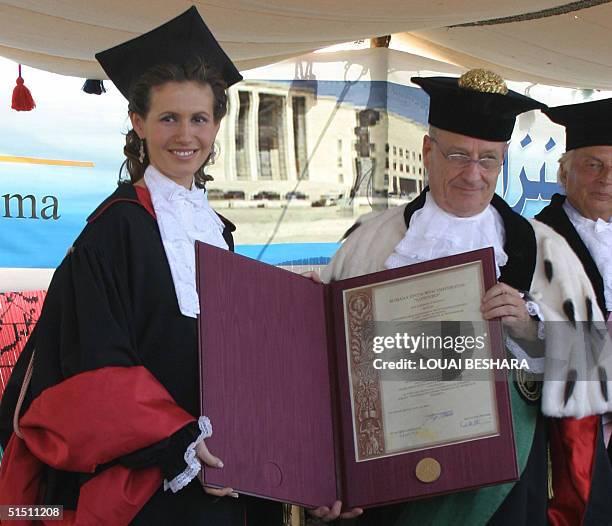 Syria's First Lady Asma al-Assad receives an honorary doctorate from the Faculty of Archeology of Rome's La Sapienza University during an official...