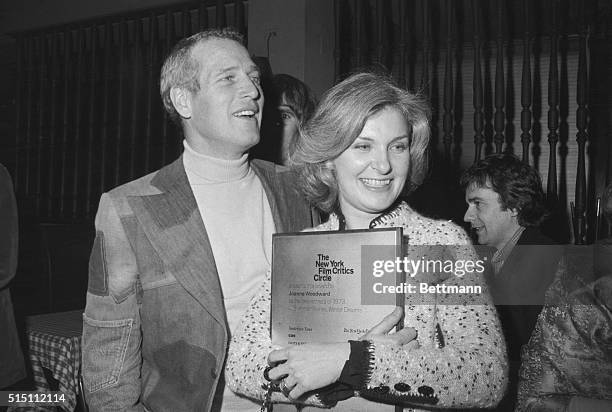 Joined by her husband, Paul Newman, actress Joanne Woodward embraces New York Film Critics Circle Award during ceremonies here January 27. Woodward...