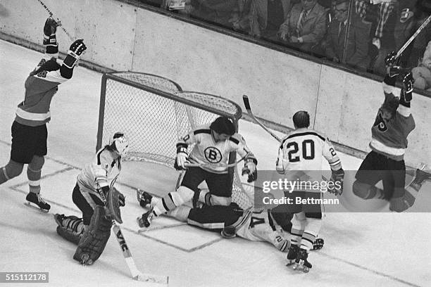 Boston, Massachusetts: Philadelphia Flyers-Bruins-Stanley Cup Finals-Boston: A diving Gilles Gilbert, Boston Bruins' goalie, isn't enough to stop...