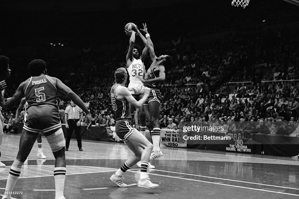 Julius Erving Leaping Before Shooting Basket