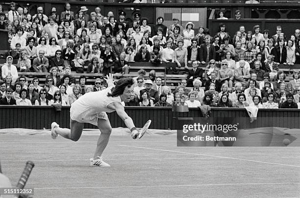 Billie Jean King of America dives across the Centre Court of Wimbledon during her match against Miss Francoise Durr of France in the Women's Singles.