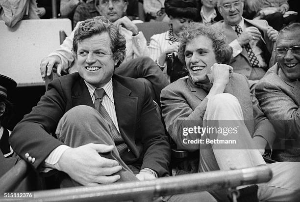Senator Edward M. Kennedy enjoys watching the Boston Celtics compete against the Milwaukee Bucks with nephew, Joseph P. Kennedy at the Boston Garden...