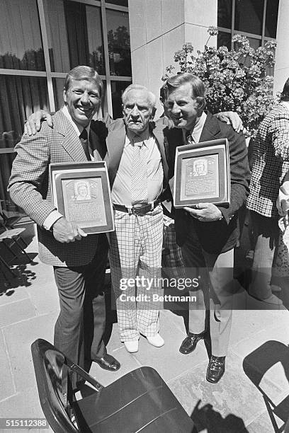 New Hall of Famers Mickey Mantle, and Whitey Ford are congratulated by the "Old Professor" Casey Stengel after the two famous Yankees were inducted...