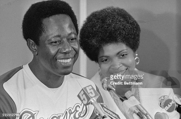 The great chase is over for Hank Aaron. "The Hammer" and his wife, Billie, smile during a news conference after the Atlanta Braves slugger hit his...