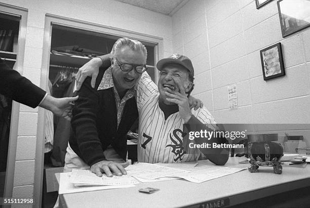 White Sox announcer, Harry Caray and Sox manager, Chuck Tanner, are all smiles and cigar after an open discussion in Tanner's office with Chicago...