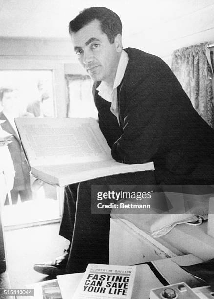 Rabbi Meir Kahane, leader of the militant Jewish Defense League, looks up from his Bible studies inside his jeep during his hunger strike outside the...