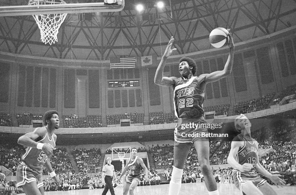Moses Malone overpowers David Twardzik of the Virginia Squires in ...