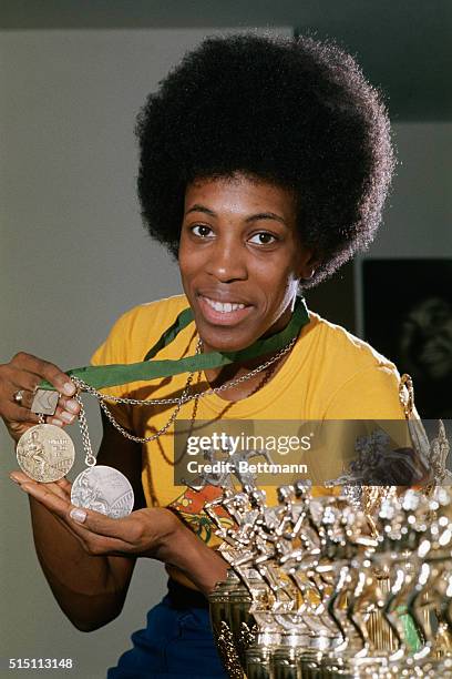 America's Madeline Manning Jackson holds her Olympic gold medal from the '68 games in Mexico, and Olympic silver medal from the '72 games in Munich...