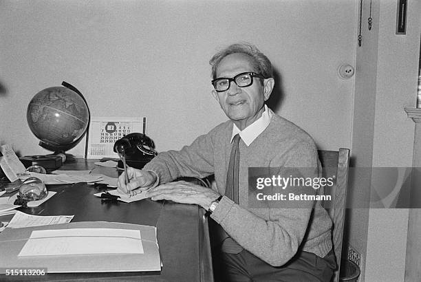 Belgian Albert Claude head of the Jules Bordet Institute in Brussels, grins as he talks to his daughter, Phillipa, in cambridge, Mass., after...