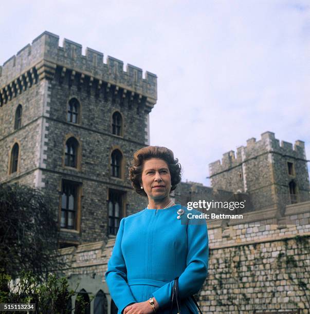 Queen Elizabeth smiles as she poses for official pictures in courtyard of Windsor Castle. The monarch celebrates her 50th birthday 4/21/76.